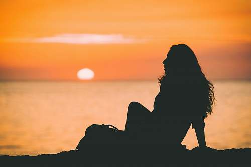 orange silhouette photo of woman at sunset baker beach